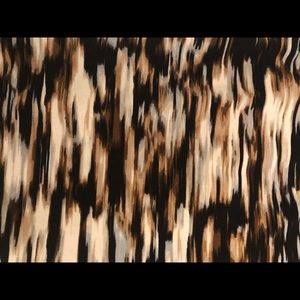 Lovely patterned sleeveless blouse.  Feminine drape at neck.